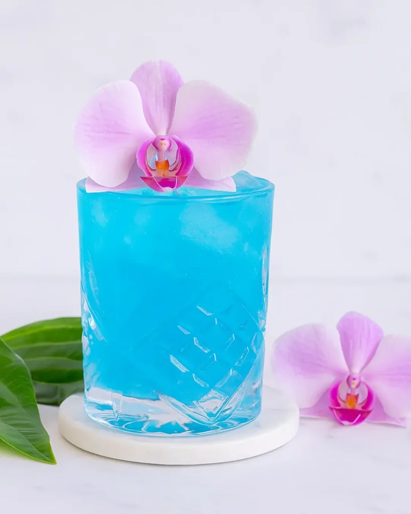 Blue Lagoon Spritzer Recipe: Fizzy, Citrus, and So Refreshing Blue Lagoon Spritzer Blue Lagoon Spritzer served outdoors