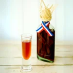 Traditional Mama Juana bottle with shot glass