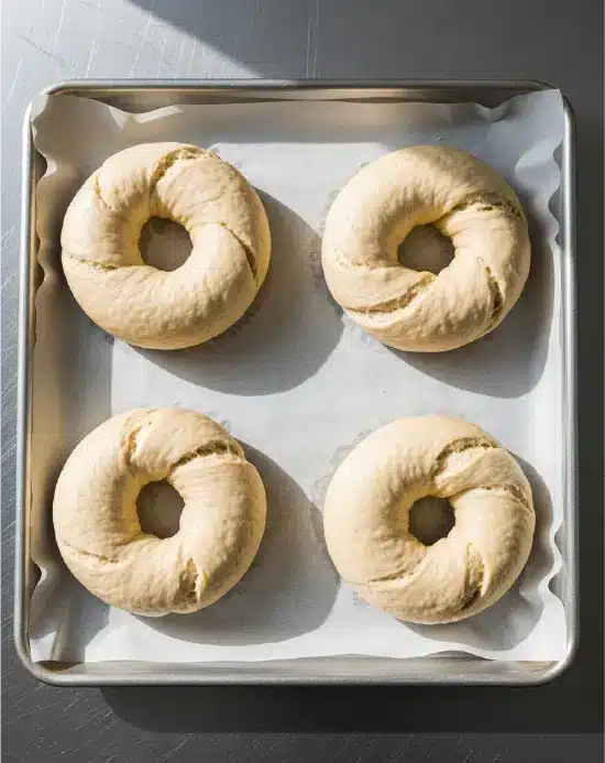 Formed gluten-free bagels ready for baking