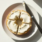 Sliced gluten-free protein bagel topped with cream cheese