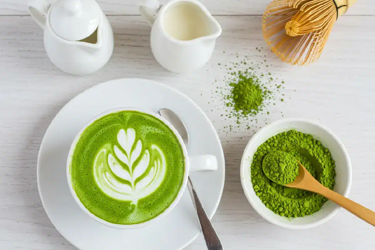vega protein matcha latte in ceramic mug on linen cloth