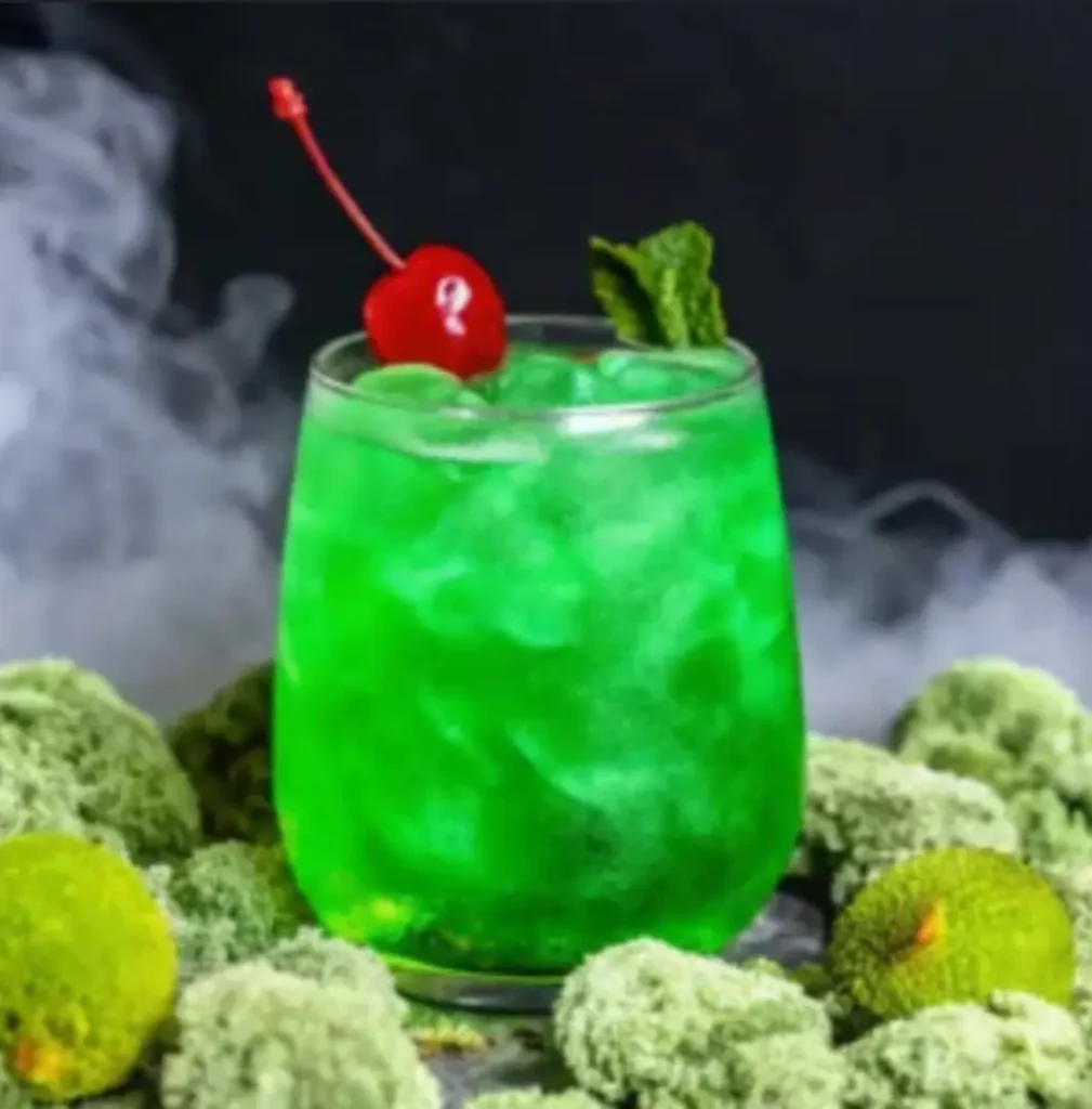 How to Make a Liquid Marijuana Cocktail: Tropical Recipe Everyone Loves! 2 Close-up of a vibrant Liquid Marijuana cocktail with garnish