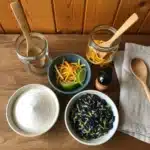 Ingredients for blue curacao syrup arranged neatly on a kitchen table