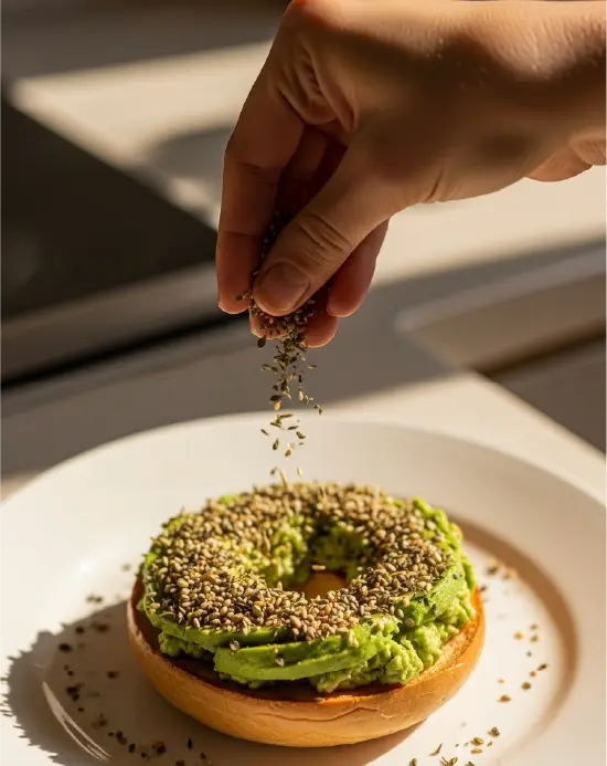 Herb & Seed Mix Protein Bagels: Easy Toppings That Nourish and Satisfy herb & seed mix for protein bagels Hand sprinkling seed mix on bagel with spread