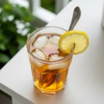 Simple Syrup 101: Complete Beginner’s Guide Simple Syrup A glass of iced tea with a spoonful of syrup being stirred in