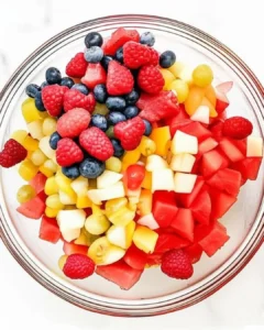 Mixed chopped fruits in a bowl before adding the liquid base