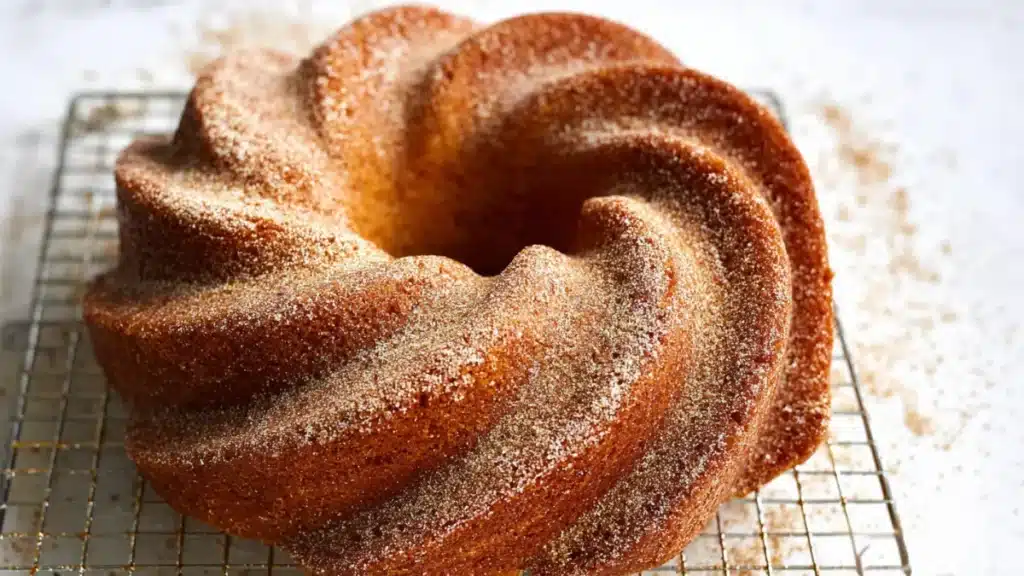 Cozy Fall Bundt Cake Recipe (Irresistibly Moist, Easy & Classic!) 1 Moist Fall Bundt Cake with glaze and pecan streusel