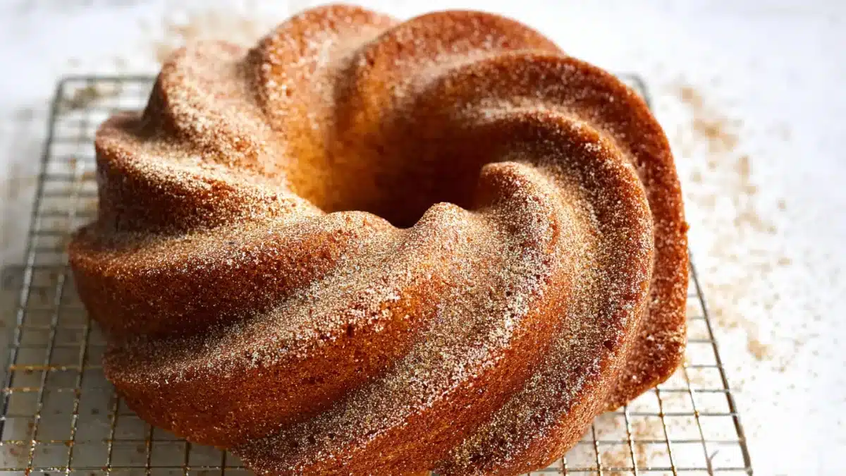 Moist Fall Bundt Cake with glaze and pecan streusel
