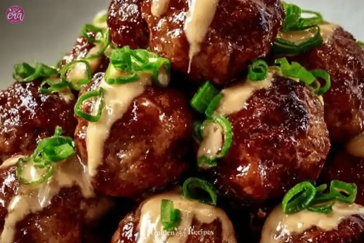 Delicious Korean BBQ meatballs garnished with green onions and sesame seeds.