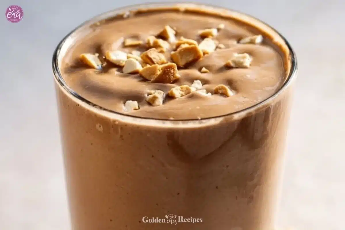 Delicious peanut butter cottage cheese smoothie in a glass topped with nuts
