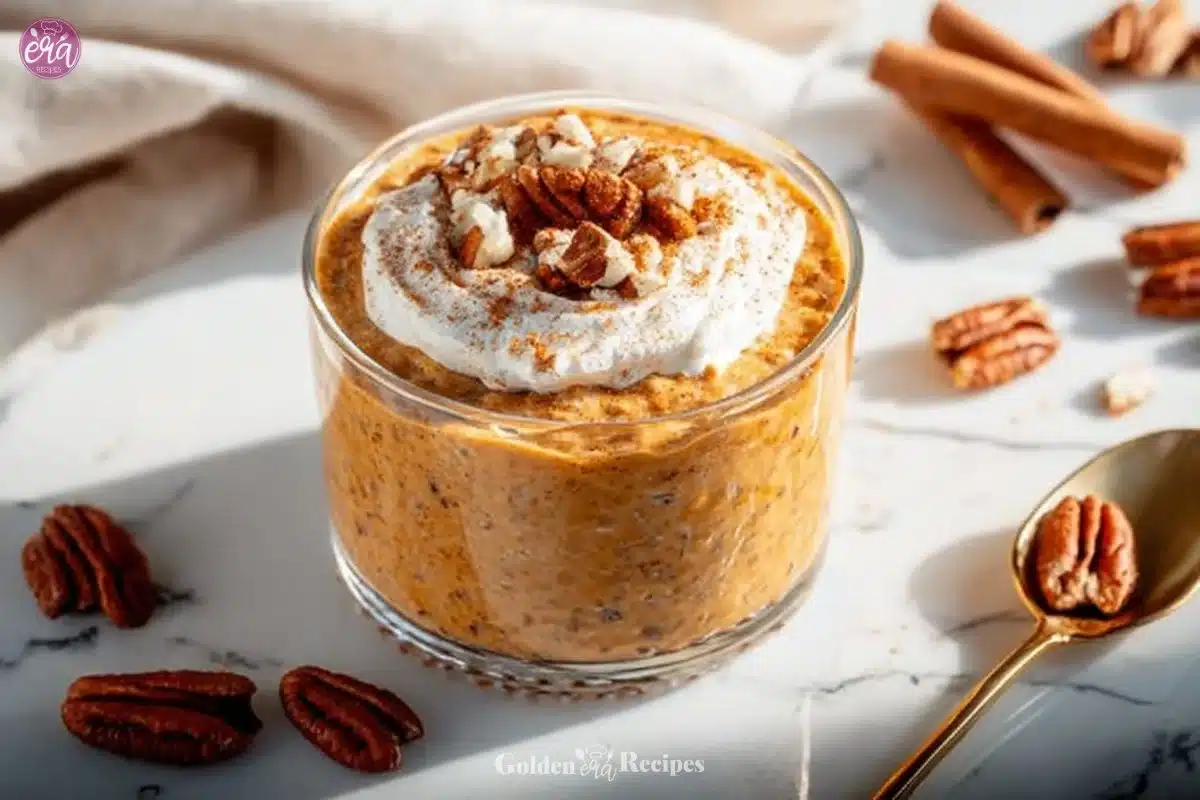 Delicious pumpkin pie overnight oats topped with chia seeds in a glass bowl