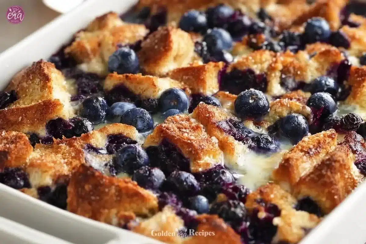 Quick blueberry French toast casserole topped with fresh blueberries and syrup