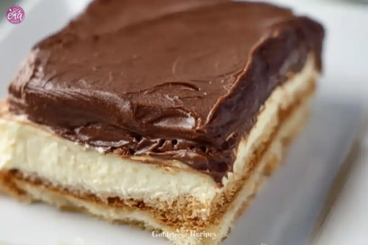 No-Bake Chocolate Eclair Cake topped with chocolate glaze and cream filling