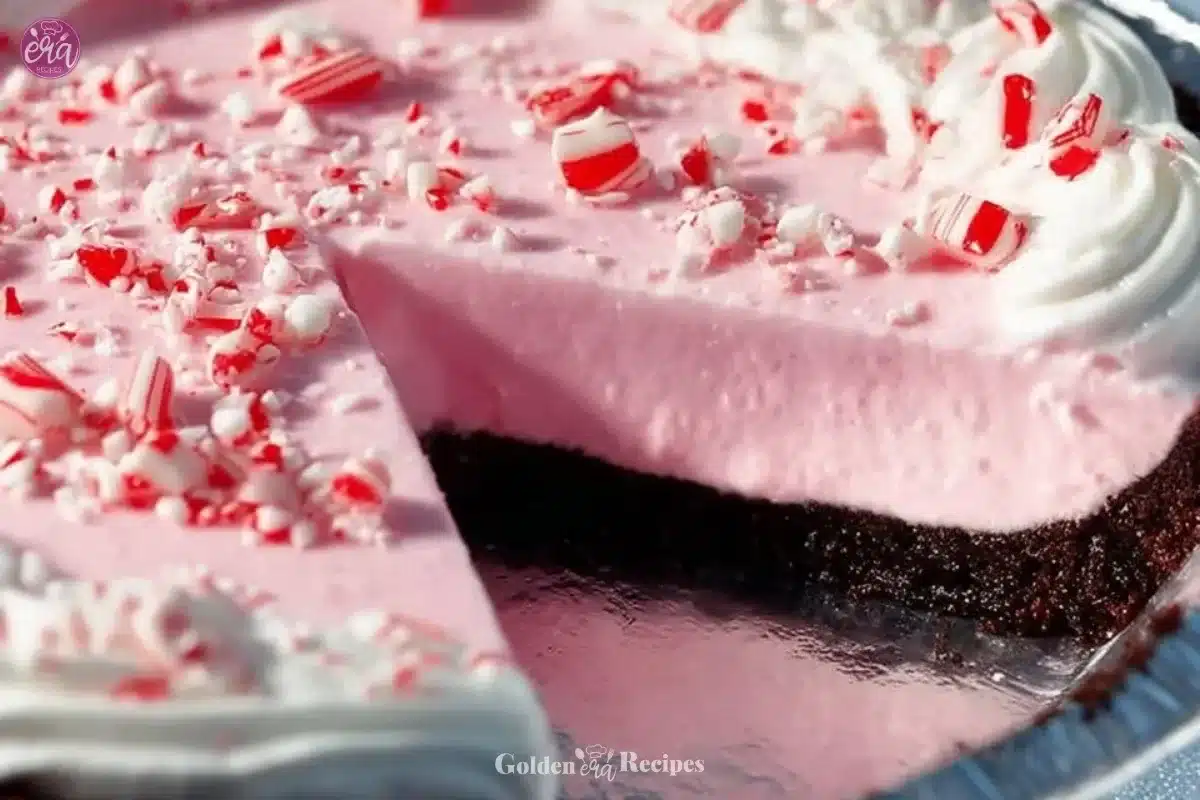 No Bake Christmas Peppermint Pie with whipped cream and peppermint sprinkles.