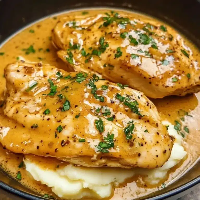 Crockpot honey mustard chicken served with vegetables on a plate.