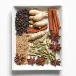 Dairy-free chai tea latte in a cup with aromatic spices and frothy texture.