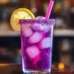 Colorful homemade unicorn lemonade in a glass with a straw