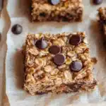 Deliciously baked Banana Oatmeal Bars displayed on a wooden table
