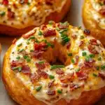 Creamy bacon cheddar bagels with crispy bacon and melted cheese