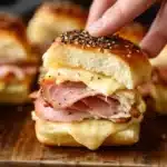 Delicious ham and cheese sliders baked to perfection, ideal for parties.