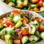 Delicious Italian cucumber salad with fresh ingredients and vibrant colors