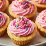 Delicious sugar cookie cups topped with frosting and sprinkles