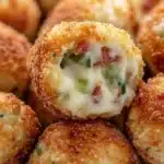 Tasty keto jalapeno popper bites served on a platter with dipping sauce