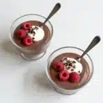 Chia seed pudding served in a bowl, topped with fresh fruits and nuts.