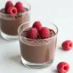 Chocolate Chia Seed Pudding served in a bowl with fresh berries on top