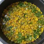 Refreshing glass of dandelion lemonade with lemon slices and dandelion flowers