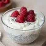 A bowl of easy vanilla chia pudding topped with fresh fruit and nuts