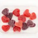 Homemade fruit gummy treats on a colorful background