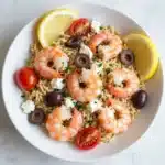 Lemon Feta Orzo with Shrimp elegantly plated, showcasing vibrant colors and fresh ingredients.