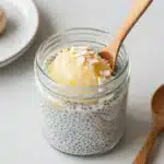 Creamy Pina Colada Chia Puddings topped with coconut and pineapple