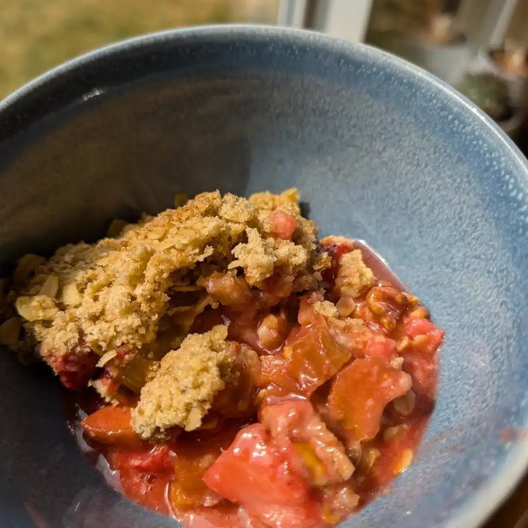 Delicious Strawberry Rhubarb Crisp served warm with a scoop of ice cream