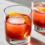 Classic Negroni cocktail with gin, Campari, and sweet vermouth served over ice.