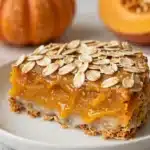 Delicious pumpkin overnight oats topped with spices and nuts in a glass bowl