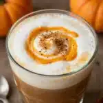 Delicious Pumpkin Spice Latte in Bloom served in a cozy café setting