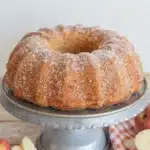 Deliciously homemade Apple Spice Bundt Cake topped with icing and apple slices