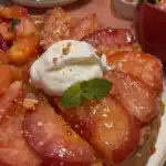 Peach Cobbler Upside Down Cake topped with fresh peach slices